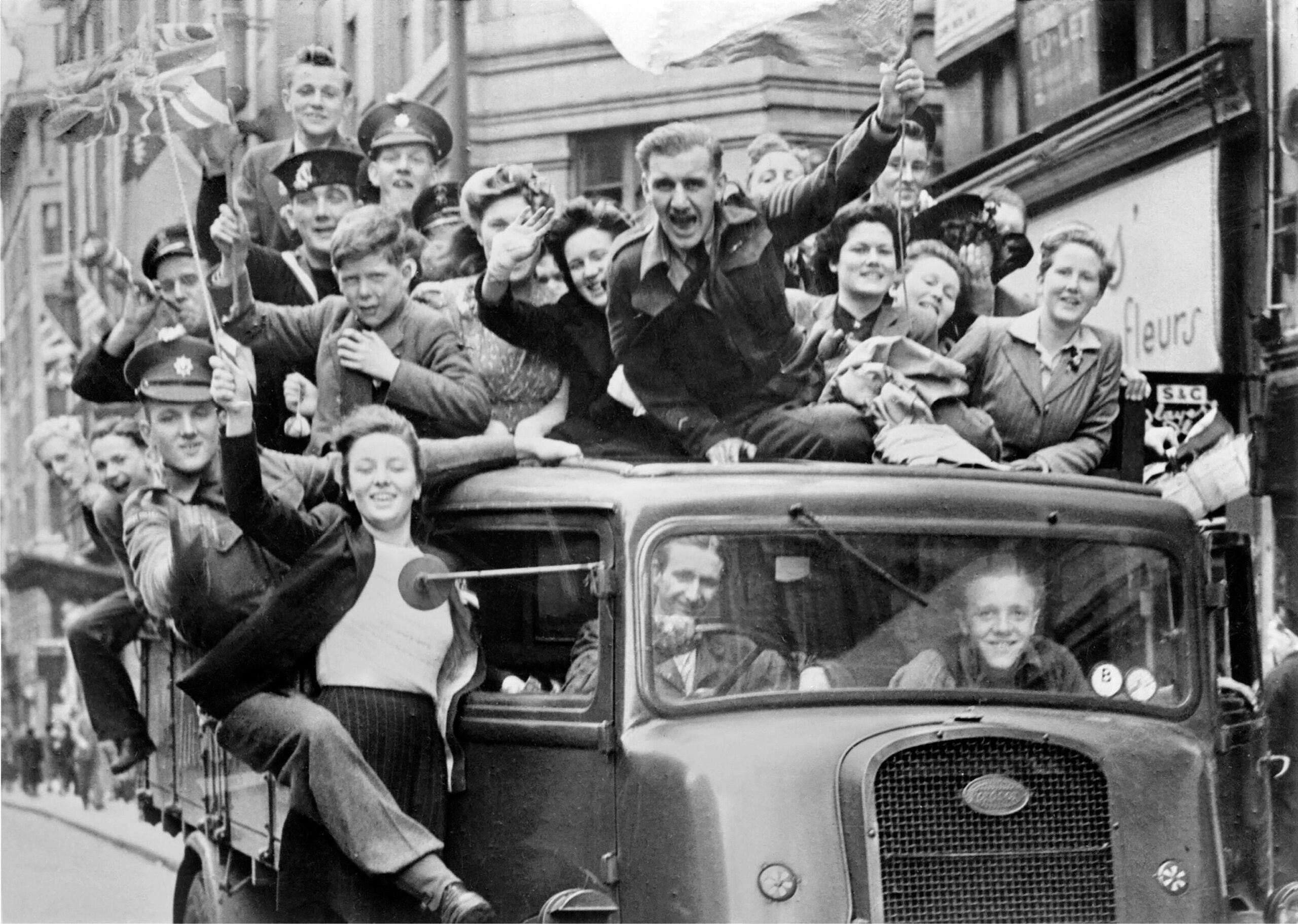 VE Day, London. Crowd of people on a truck in the Strand, London on V-E Day after the announcement of the German surrender, 8th May 1945